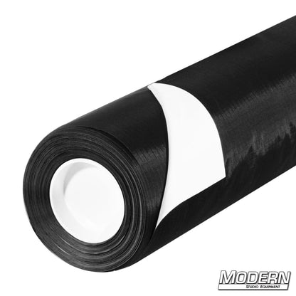 Rolls of Ultrabounce fabric with white and black surfaces, designed for lighting control in photography and film