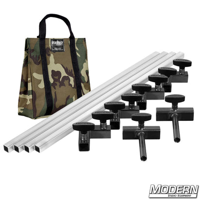 Film production frame kit showing aluminum tubes, ears, and connectors laid out with camo bag
