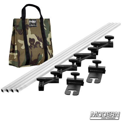 Set of audio equipment with clamps and a camouflage bag on a white background