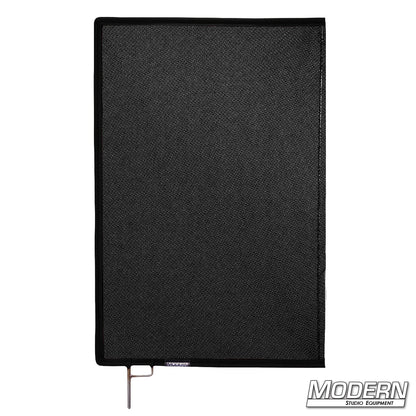 Black Triple Scrim mounted in frame on lighting stand for controlled illumination